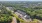  A bird's eye view of an apartment complex surrounded by trees.