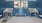  A room with blue tiles and two sinks.